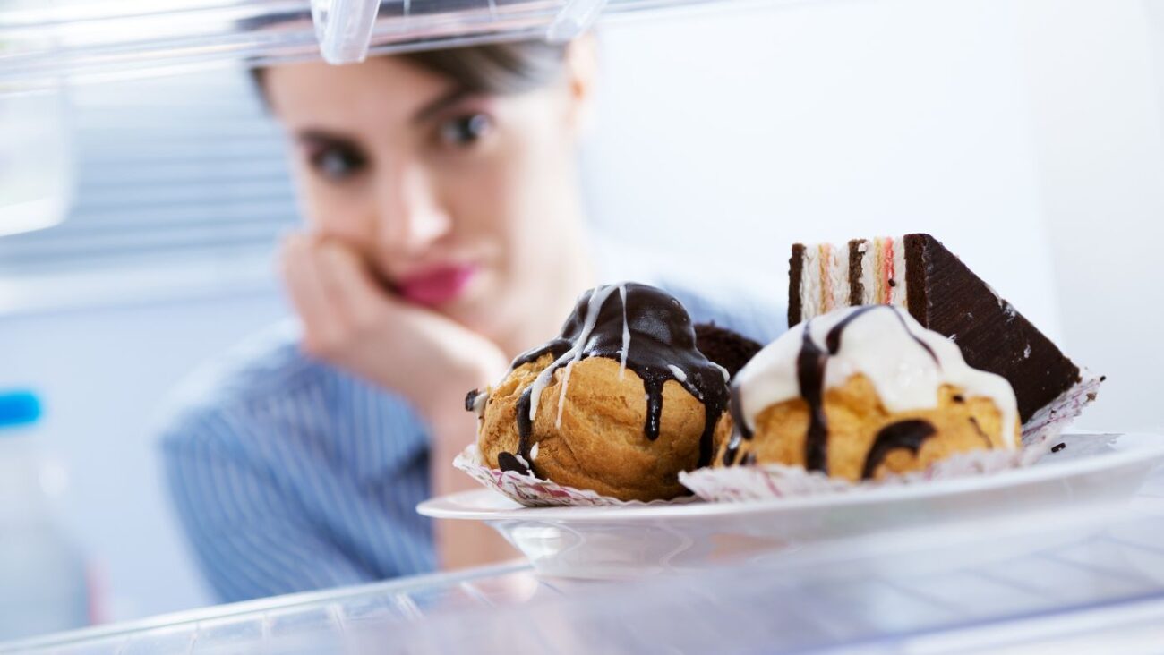 Can Ozempic or Mounjaro Stop Binge Eating? A woman on weight loss medications considering her options