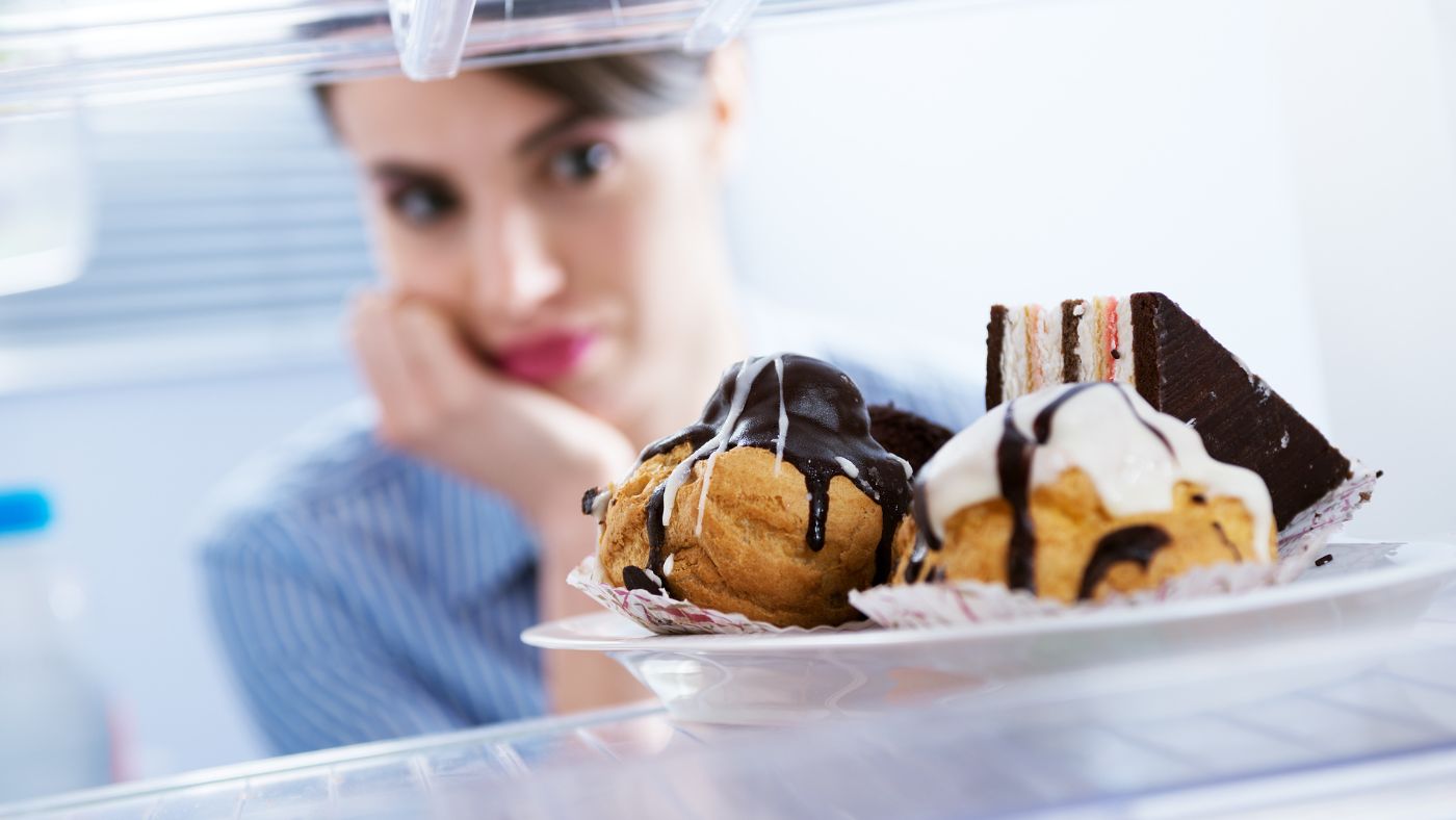 Can Ozempic or Mounjaro Stop Binge Eating? A woman on weight loss medications considering her options