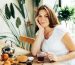 6 Ways to Reduce Food Noise Naturally: Quiet Your Mind Without GLP-1s- a woman smiling around food